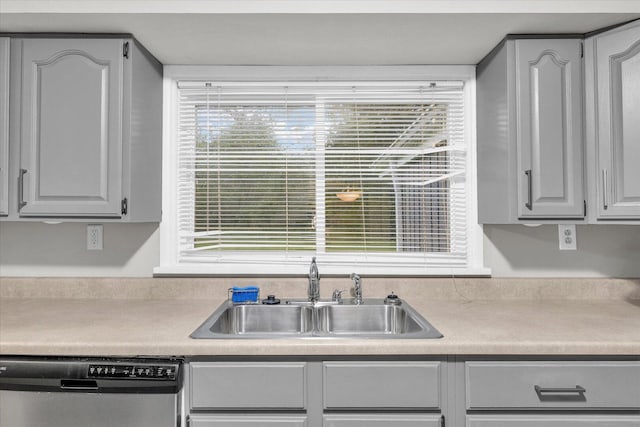 724 Dover Pl, Champaign, IL 61820 - kitchen featuring stainless steel dishwasher, plenty of natural light, and light countertops