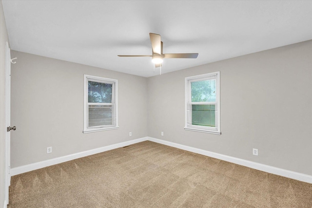 724 Dover Pl, Champaign, IL 61820 - spare room featuring carpet floors and a ceiling fan