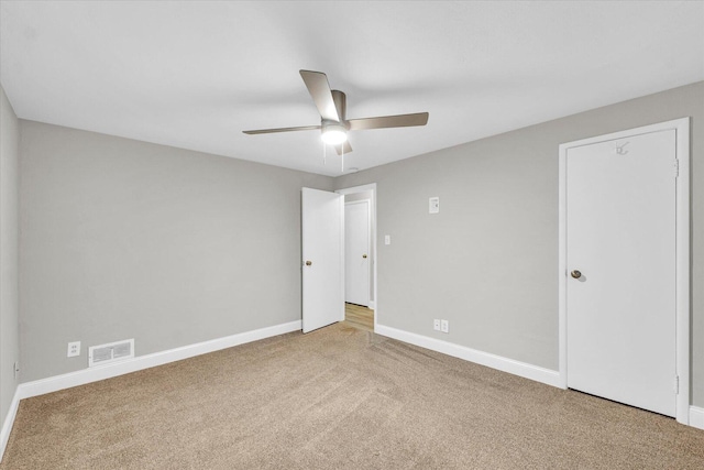 724 Dover Pl, Champaign, IL 61820 - unfurnished bedroom featuring carpet flooring and ceiling fan