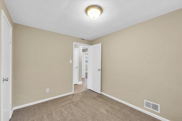 724 Dover Pl, Champaign, IL 61820 - unfurnished bedroom featuring carpet flooring and baseboards