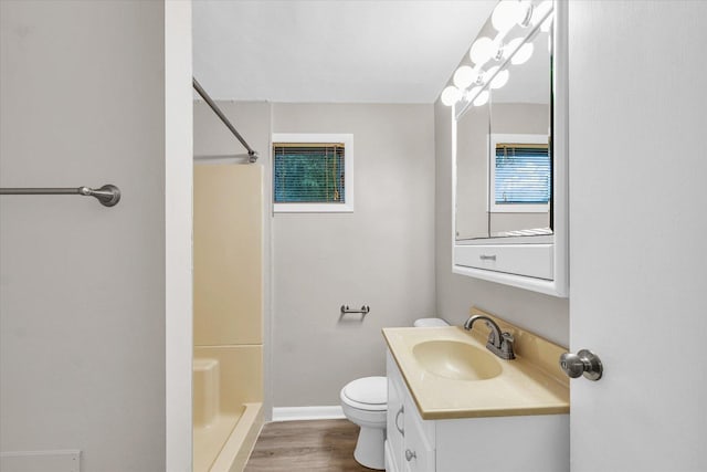 724 Dover Pl, Champaign, IL 61820 - bathroom with a shower, wood finished floors, and vanity