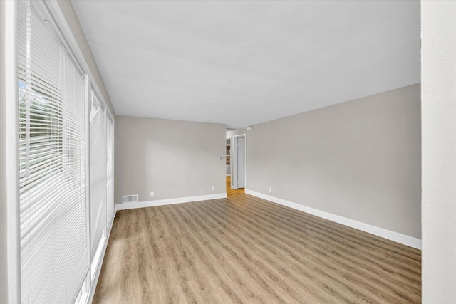 724 Dover Pl, Champaign, IL 61820 - unfurnished bedroom featuring light wood-style floors and baseboards