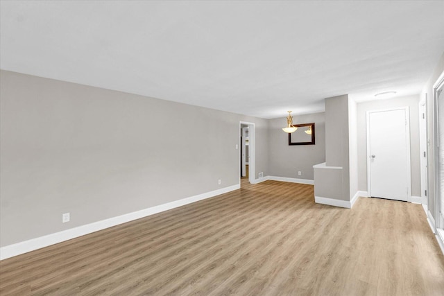 724 Dover Pl, Champaign, IL 61820 - spare room featuring light wood-style floors and baseboards