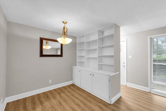 724 Dover Pl, Champaign, IL 61820 - unfurnished dining area with light wood-style flooring
