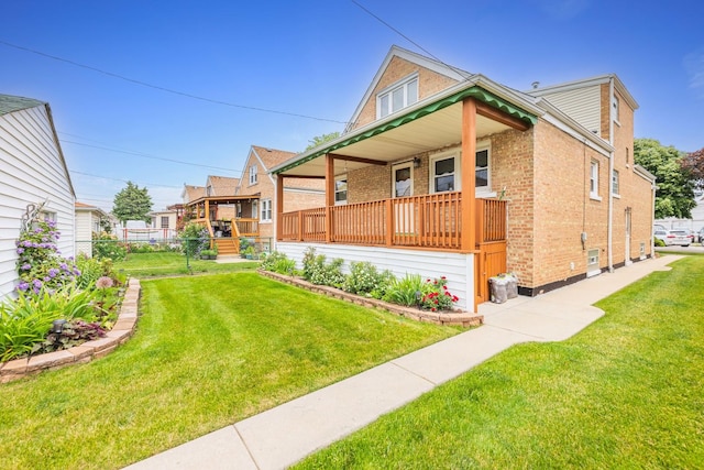 4512 S Trumbull Ave, Chicago, IL 60632 - view of front of house with brick siding, a porch, and a front yard
