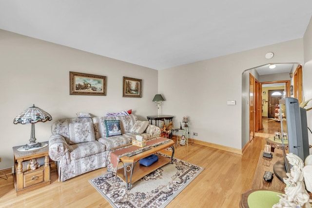 4512 S Trumbull Ave, Chicago, IL 60632 - living area featuring arched walkways and light wood-type flooring