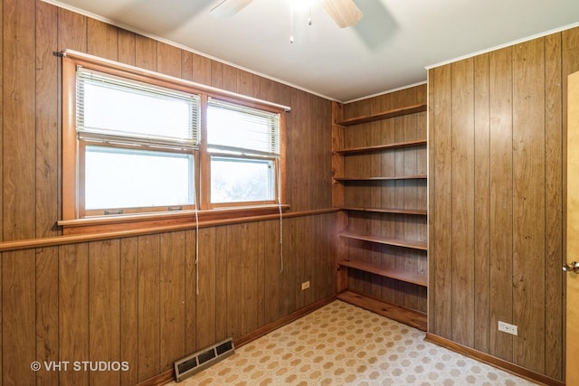 5341 Grand Ave, Downers Grove, IL 60515 - spare room with wooden walls, ceiling fan, and ornamental molding