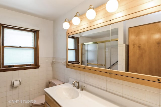 5341 Grand Ave, Downers Grove, IL 60515 - bathroom featuring a shower stall, vanity, and tile walls