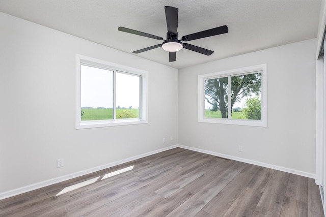 3472 N Il St Unit 23, Ottawa, IL 61350 - spare room with wood finished floors and a ceiling fan