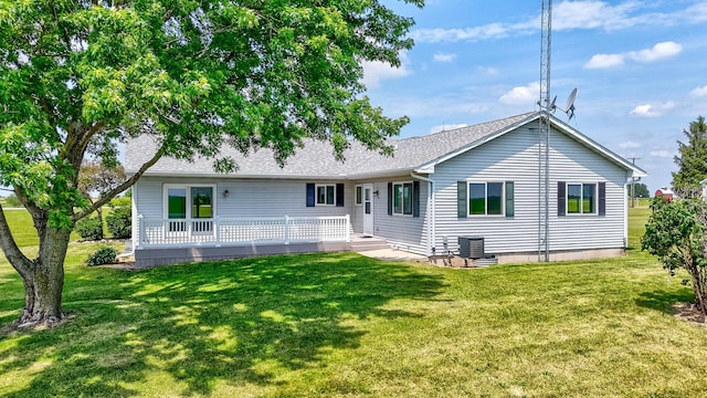3472 N Il St Unit 23, Ottawa, IL 61350 - back of house with a lawn and a shingled roof