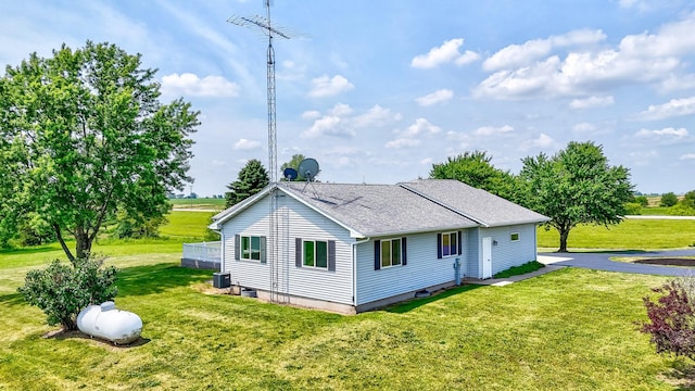 3472 N Il St Unit 23, Ottawa, IL 61350 - view of side of property featuring a lawn and a shingled roof