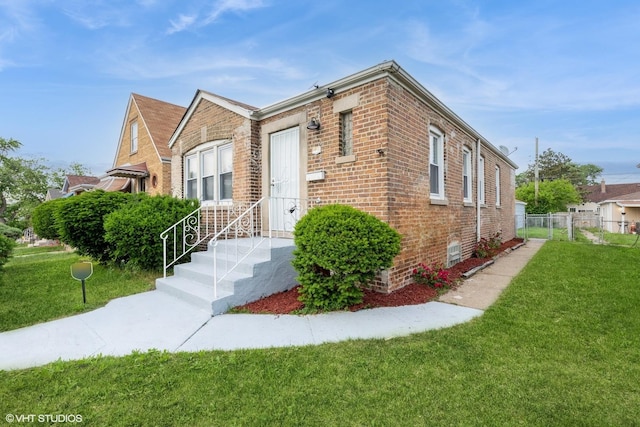 9811 S Woodlawn Ave, Chicago, IL 60628 - view of front of house featuring brick siding