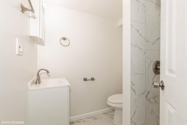 9811 S Woodlawn Ave, Chicago, IL 60628 - bathroom with vanity, marble look tile flooring, and a shower