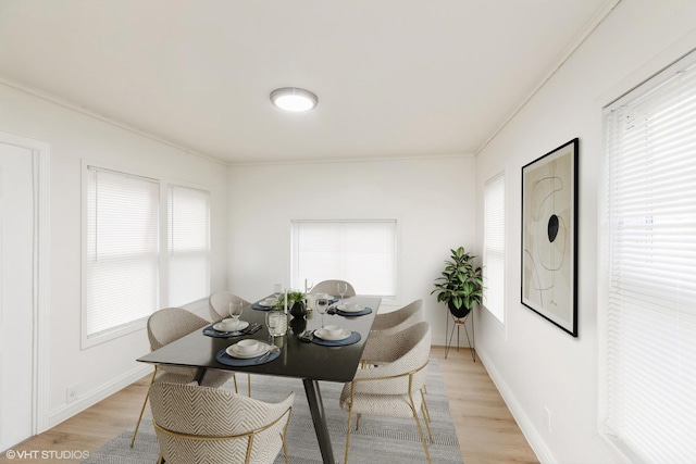 9811 S Woodlawn Ave, Chicago, IL 60628 - dining space with light wood-type flooring and crown molding