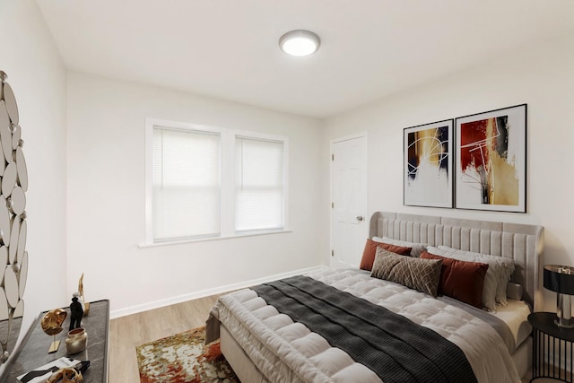 9811 S Woodlawn Ave, Chicago, IL 60628 - bedroom featuring wood finished floors and baseboards