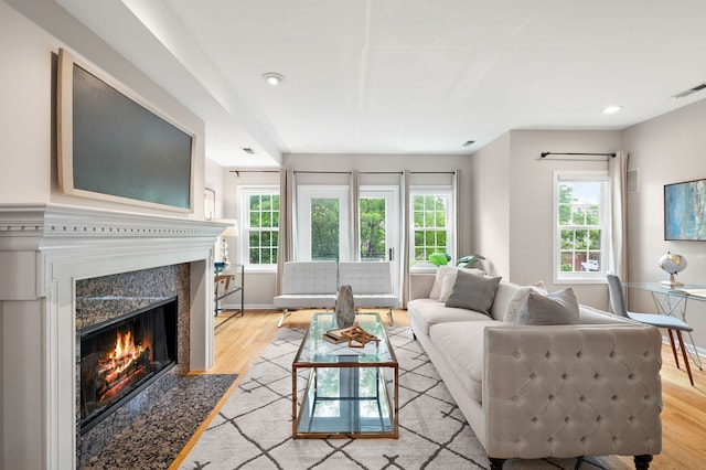 1242 W Ohio St Unit 2E, Chicago, IL 60642 - living room with a premium fireplace, light wood-type flooring, and recessed lighting