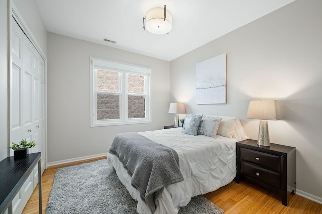 1242 W Ohio St Unit 2E, Chicago, IL 60642 - bedroom with light wood-style flooring and a closet