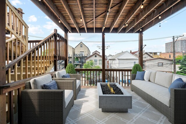 1242 W Ohio St Unit 2E, Chicago, IL 60642 - view of patio featuring stairs, an outdoor living space with a fire pit, and a residential view