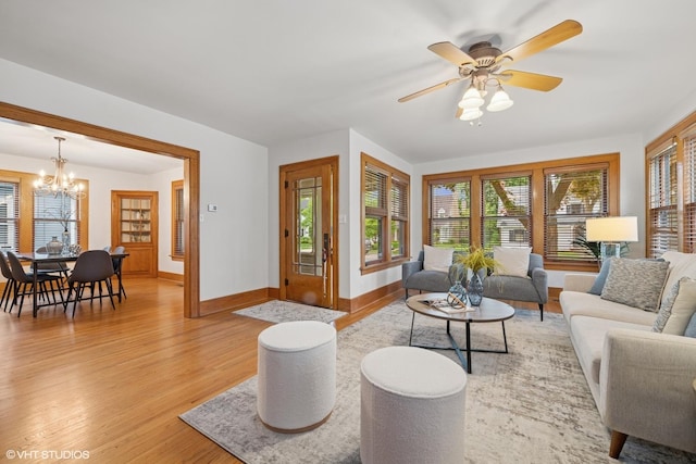 128 Coolidge Ave, Barrington, IL 60010 - living area with light wood-type flooring, a chandelier, plenty of natural light, and ceiling fan