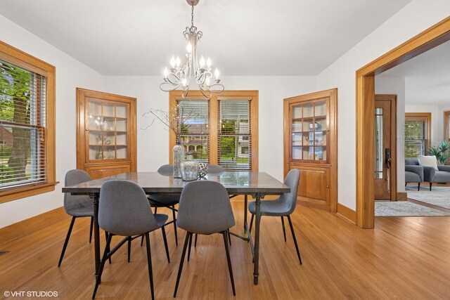 128 Coolidge Ave, Barrington, IL 60010 - dining room featuring light wood-style flooring and a chandelier