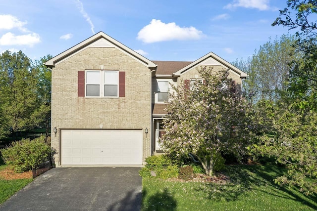 1018 Butterfield Cir E, Shorewood, IL 60404 - view of front facade featuring an attached garage, asphalt driveway, and brick siding