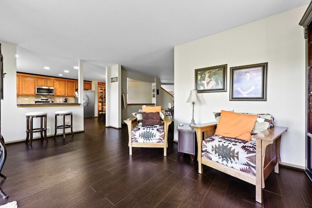 1018 Butterfield Cir E, Shorewood, IL 60404 - living room with recessed lighting, dark wood-style floors, and stairs