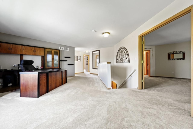 1018 Butterfield Cir E, Shorewood, IL 60404 - kitchen with carpet floors, an office area, and dark countertops