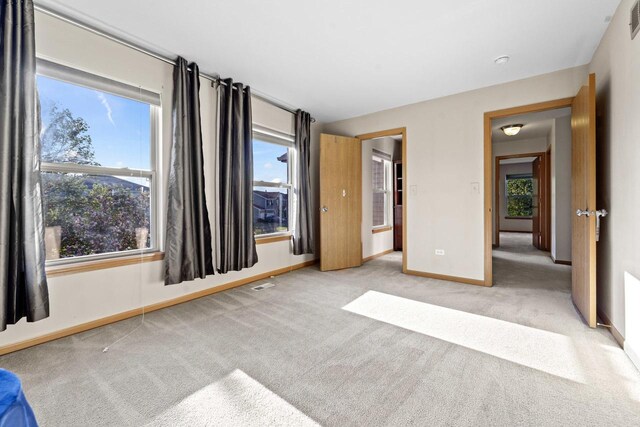 1018 Butterfield Cir E, Shorewood, IL 60404 - unfurnished bedroom featuring carpet and baseboards