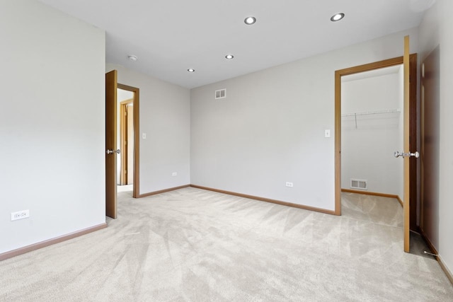 1018 Butterfield Cir E, Shorewood, IL 60404 - empty room featuring light carpet and recessed lighting