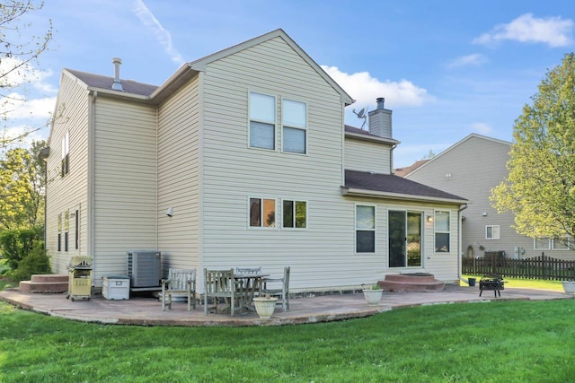 1018 Butterfield Cir E, Shorewood, IL 60404 - rear view of house with a patio area and a chimney