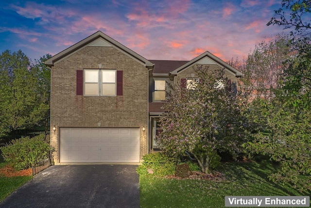 1018 Butterfield Cir E, Shorewood, IL 60404 - traditional-style home featuring an attached garage, driveway, and brick siding