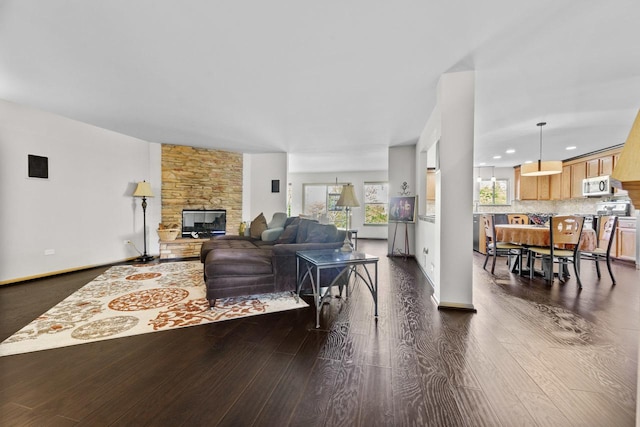 1018 Butterfield Cir E, Shorewood, IL 60404 - living room with a stone fireplace, dark wood-style flooring, and recessed lighting