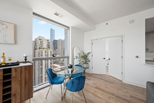303 W Ohio St Unit 2302, Chicago, IL 60654 - dining space with wood finished floors and a view of city