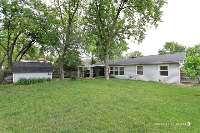 115 Red Bridge Rd, Lake Zurich, IL 60047 - rear view of house with a storage unit and a fenced backyard