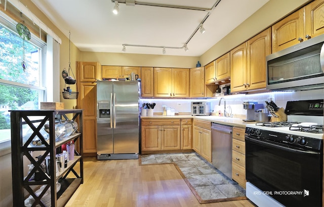 115 Red Bridge Rd, Lake Zurich, IL 60047 - kitchen with appliances with stainless steel finishes, track lighting, light countertops, and light wood-type flooring
