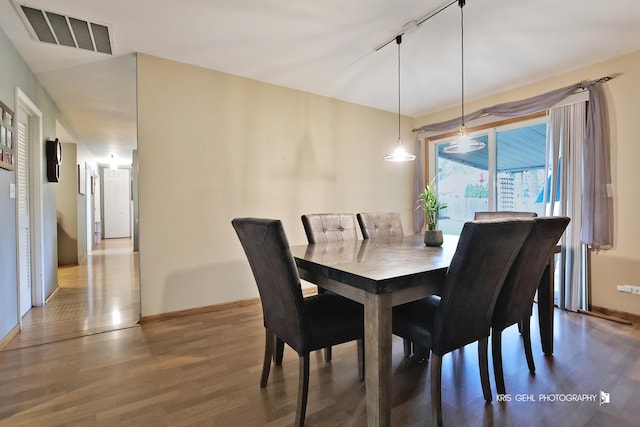 115 Red Bridge Rd, Lake Zurich, IL 60047 - dining space featuring wood finished floors and rail lighting
