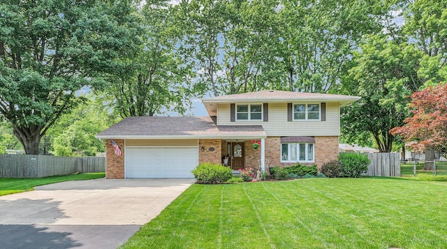 20 Park Dr, Villa Grove, IL 61956 - view of front of house featuring an attached garage, concrete driveway, and brick siding