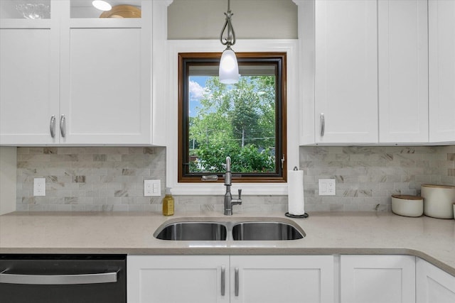 20 Park Dr, Villa Grove, IL 61956 - kitchen featuring dishwasher, white cabinetry, backsplash, and hanging light fixtures