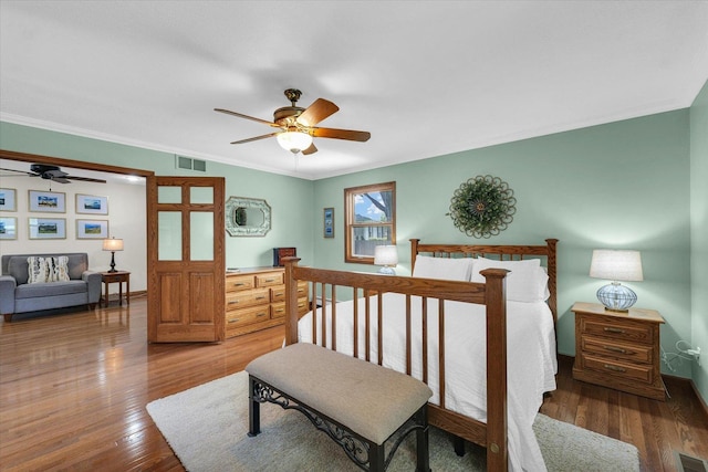 20 Park Dr, Villa Grove, IL 61956 - bedroom featuring wood finished floors and ornamental molding