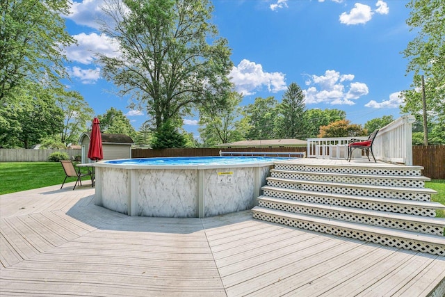 20 Park Dr, Villa Grove, IL 61956 - wooden terrace with a fenced backyard and a shed
