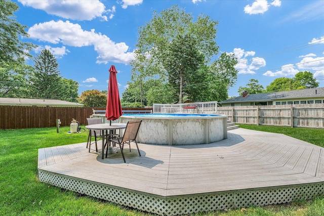 20 Park Dr, Villa Grove, IL 61956 - deck featuring a fenced backyard and outdoor dining space