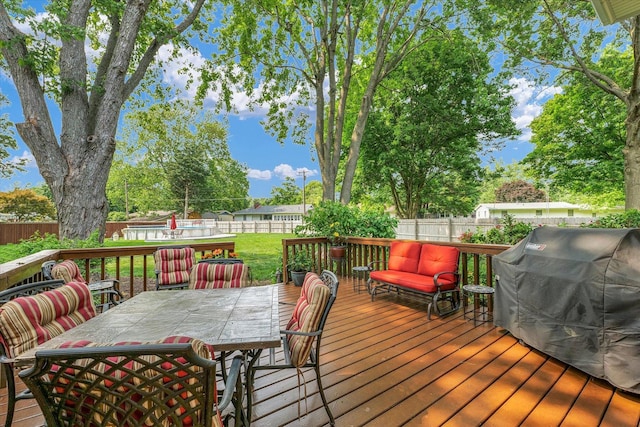 20 Park Dr, Villa Grove, IL 61956 - wooden deck featuring outdoor dining space, a fenced backyard, and grilling area