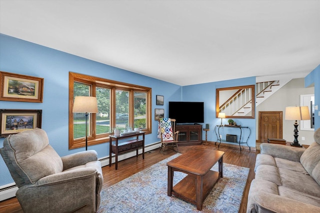 20 Park Dr, Villa Grove, IL 61956 - living room with a baseboard radiator, stairs, and wood finished floors