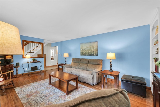 20 Park Dr, Villa Grove, IL 61956 - living room featuring stairs and wood finished floors