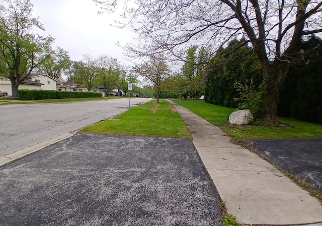 540 Homan Ave, Park Forest, IL 60466 - view of asphalt street featuring sidewalks, traffic signs, and a residential view