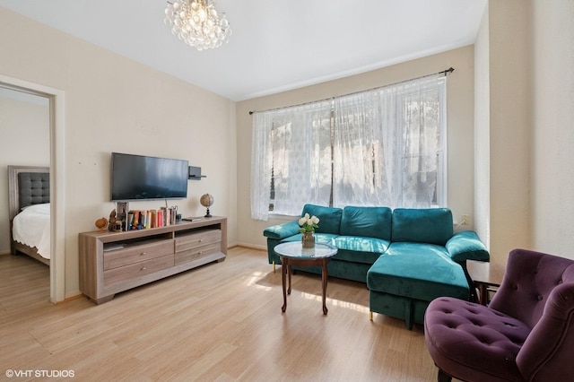 902 W Margate Ter Unit 2D, Chicago, IL 60640 - living area with wood finished floors and a chandelier