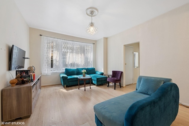 902 W Margate Ter Unit 2D, Chicago, IL 60640 - living room featuring light wood-style floors and a chandelier
