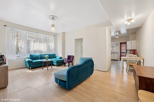 902 W Margate Ter Unit 2D, Chicago, IL 60640 - living area with light wood-type flooring and a chandelier