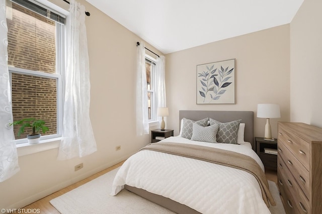 902 W Margate Ter Unit 2D, Chicago, IL 60640 - bedroom featuring wood finished floors and baseboards