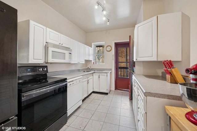 902 W Margate Ter Unit 2D, Chicago, IL 60640 - kitchen featuring white appliances, light countertops, white cabinets, light tile patterned flooring, and rail lighting
